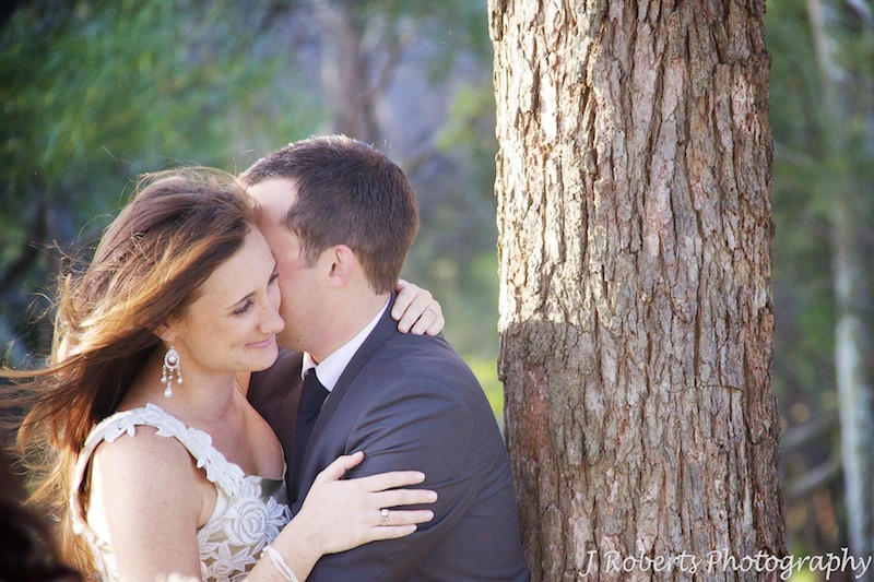 romantic shot of married couple embracing - wedding photography sydney